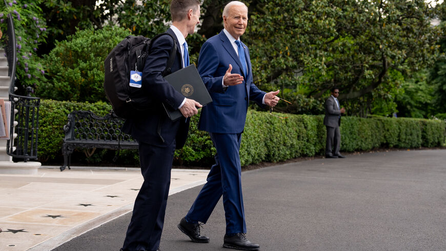 WASHINGTON, DC - MAY 8: U.S. President Joe Biden accompanied by Deputy Chief of Staff Bruce Reed (L) reacts to reporters shouted questions as he walks to Marine One on the South Lawn of the White House on May 8, 2024 in Washington, DC, for a short trip to Andrews Air Force Base, Maryland. Biden is traveling to Wisconsin and Illinois today for campaign events. (Photo by Andrew Harnik/Getty Images)