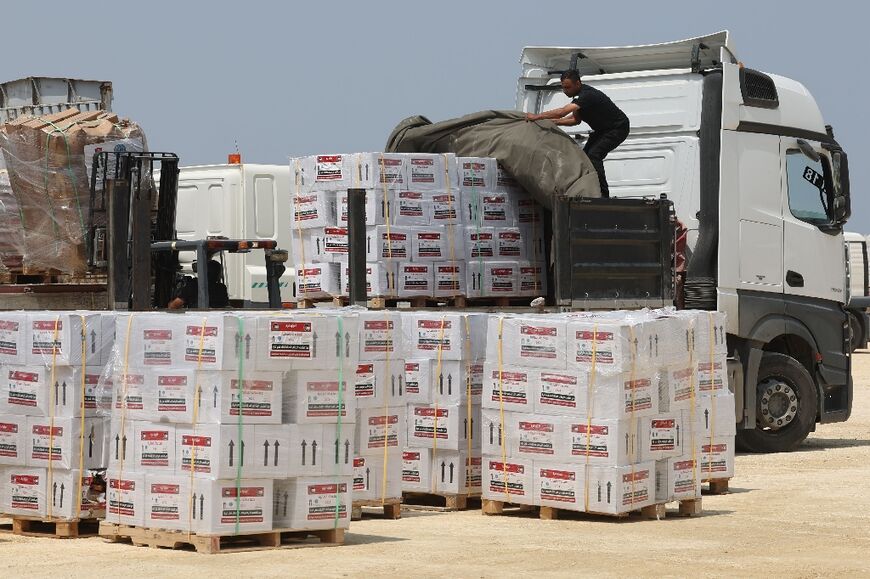 This photograph taken during a tour organised by the Israeli military shows workers unloading aid in northern Gaza after it was delivered through the newly reopened Erez crossing