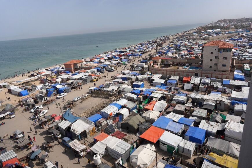 Many Palestinians are crowded into shelters along the seashire in Deir al-Balah, central Gaza